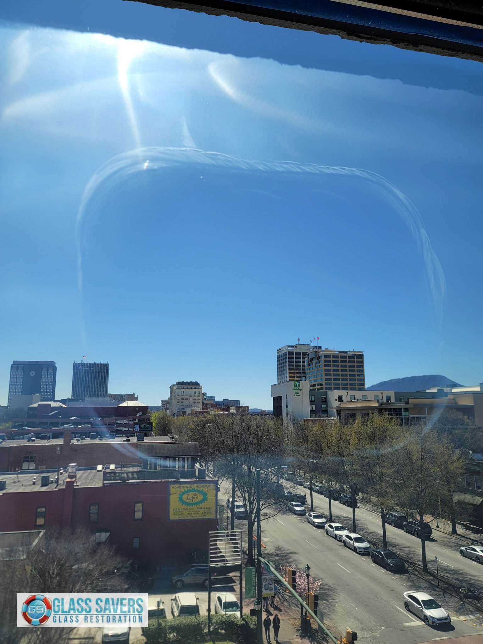 Before and after comparison of on-site glass scratch removal demo in Chattanooga commercial building