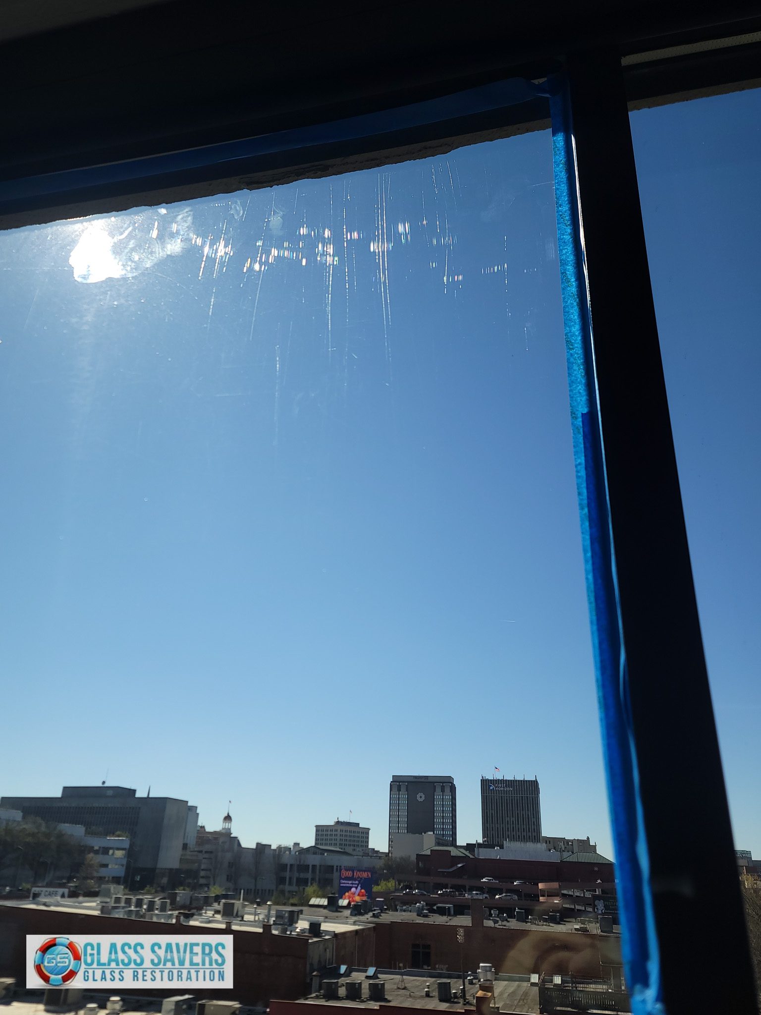 Glass Savers technician performing commercial glass scratch removal on oversized IG panel in Chattanooga TN