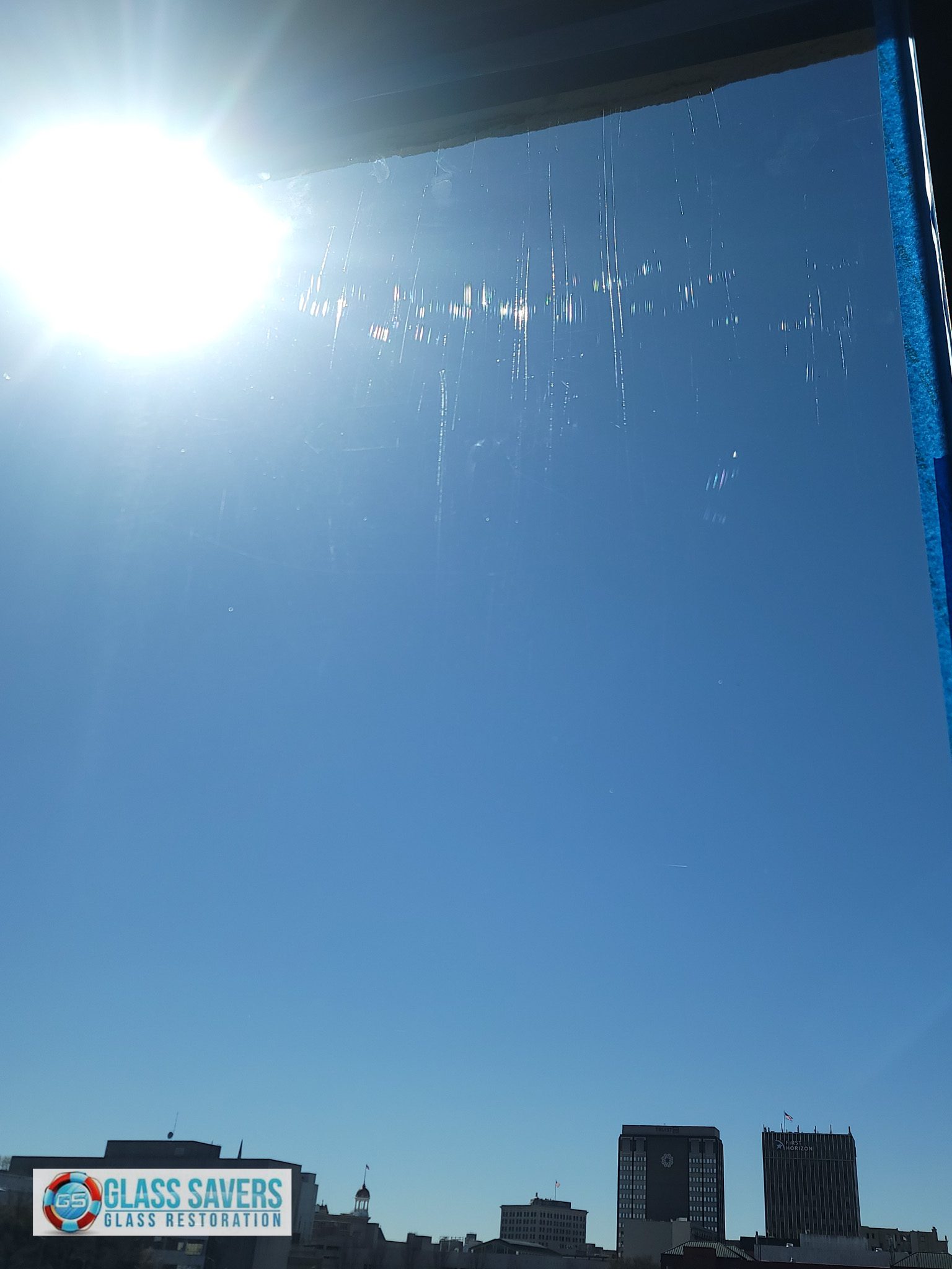 Scratched commercial glass panels before restoration in Chattanooga TN